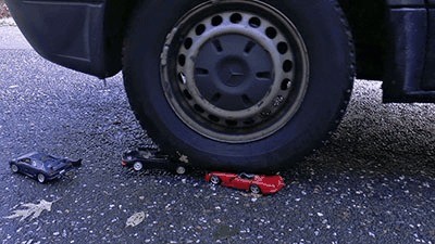 Metal Cars Shred Under Heavy Tires