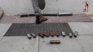 Train Wagons Under Sandals And Wooden Clog Head View